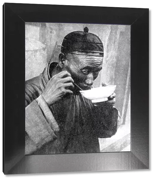 A man eating, Mukden (Shenyang), China, 1936. Artist: Wide World Photos