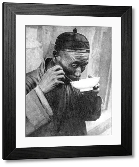 Framed Print : A man eating, Mukden (Shenyang), China, 1936. Artist: Wide World Photos Framed Print : A man eating, Mukden (Shenyang), China, 1936. Artist: Wide World Photos