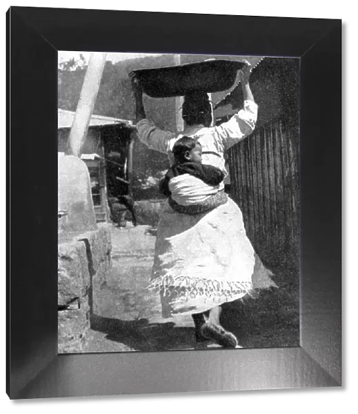 A Korean woman carrying a baby on her back, 1936. Artist: Wide World Photos
