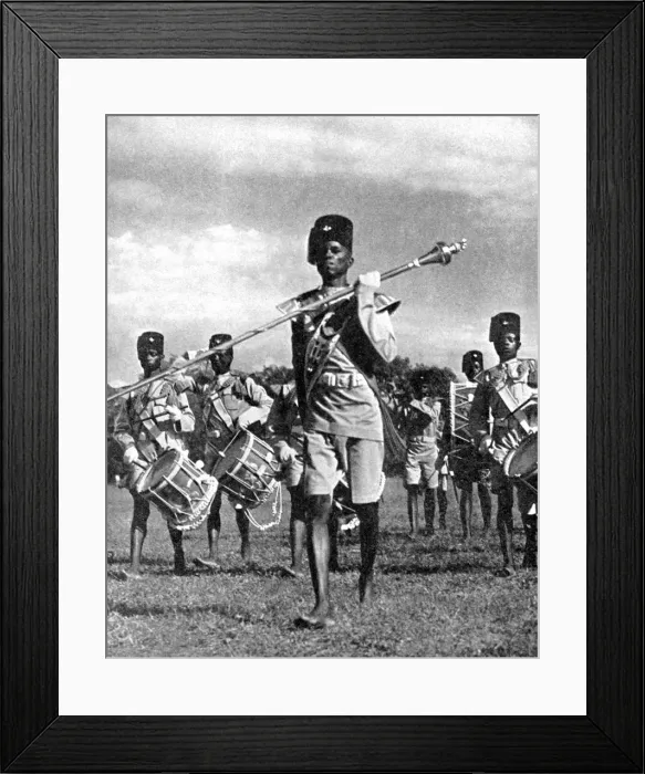 Framed Print : Bandsmen of the Northern Rhodesia Regiment beat a military tattoo, Zimbabwe, Africa, 1936. Artist: LNA Images