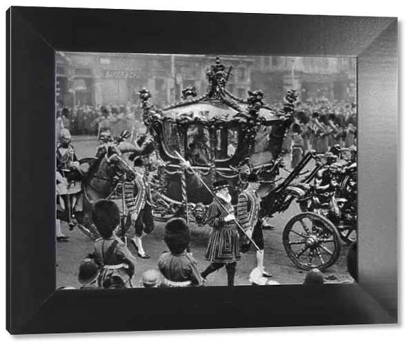 The royal coach on its way to open parliament, London, 1926-1927