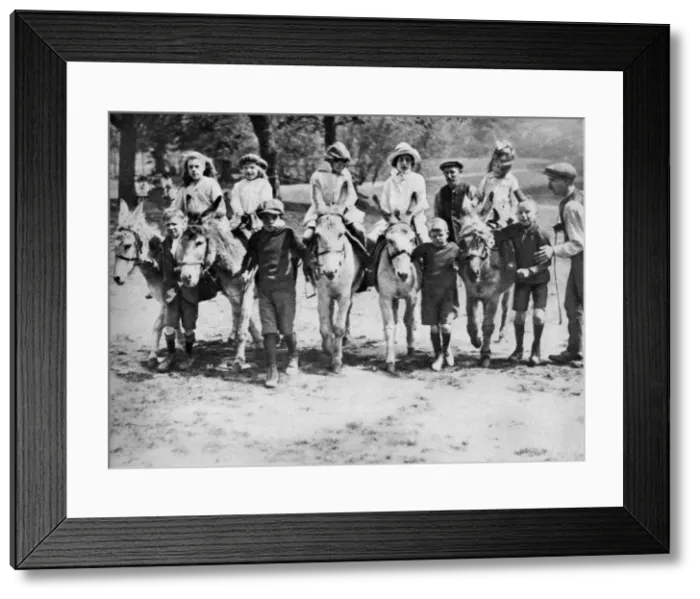 Framed Print : A donkey ride on a bank holiday on Hamstead Heath, London, 1926-1927 Framed Print : A donkey ride on a bank holiday on Hamstead Heath, London, 1926-1927
