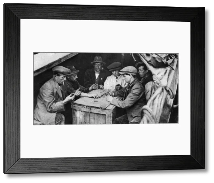 Framed Print : A bargee and his mates play dominoes in the hold of a canal boat, 1926-1927 Framed Print : A bargee and his mates play dominoes in the hold of a canal boat, 1926-1927