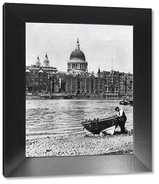 Thames waterman and his boat on the beach at Bankside, London, 1926-1927. Artist: McLeish