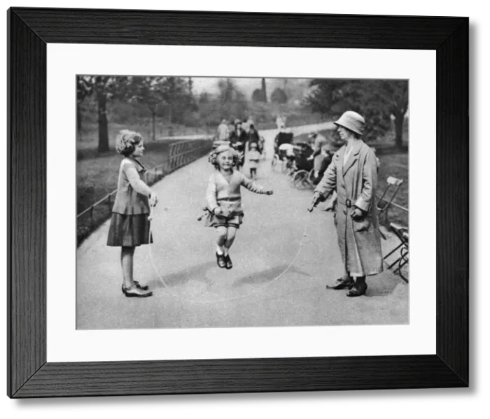 Framed Print : Girl skipping, Hyde Park, London, 1926-1927 Framed Print : Girl skipping, Hyde Park, London, 1926-1927