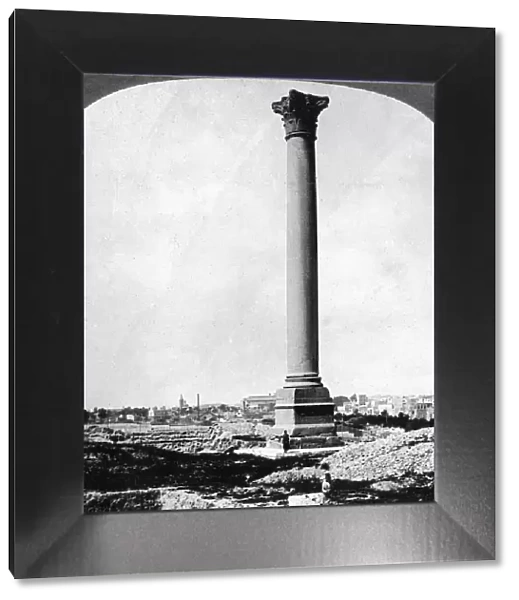 Pompeys Pillar, the sailors landmark, and modern Alexandria, Egypt, 1905. Artist: Underwood & Underwood