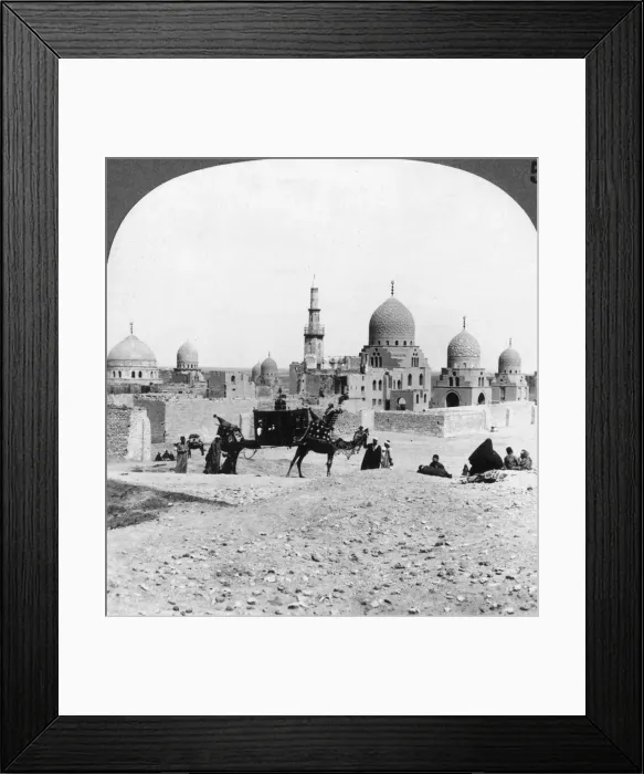 Framed Print : A Ship of the Desert passing tombs of by-gone Moslem rulers, Cairo, Egypt, 1905. Artist: Underwood & Underwood Framed Print : A Ship of the Desert passing tombs of by-gone Moslem rulers, Cairo, Egypt, 1905. Artist: Underwood & Underwood