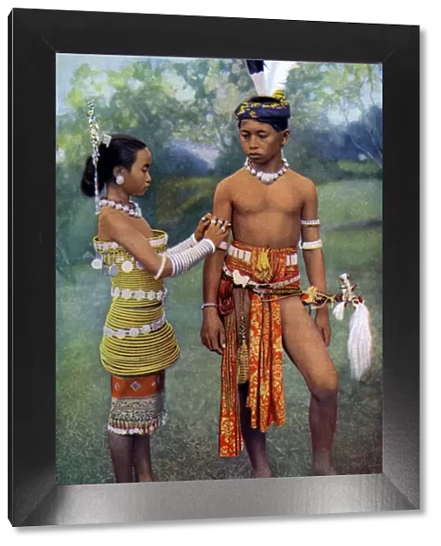 Young Iban or Sea Dayaks people in gala attire, Borneo, 1922. Artist: Dr Charles Hose