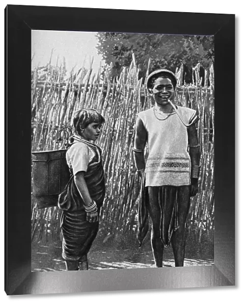 A Moi couple inside the village palisade, Africa, 1922