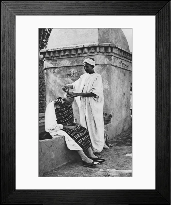 Framed Print : A street barber and his client, Algeria, Africa, 1922. Artist: Donald McLeish Framed Print : A street barber and his client, Algeria, Africa, 1922. Artist: Donald McLeish