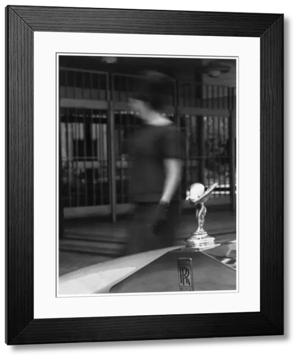 Framed Print : Woman walking past a Rolls-Royce Framed Print : Woman walking past a Rolls-Royce