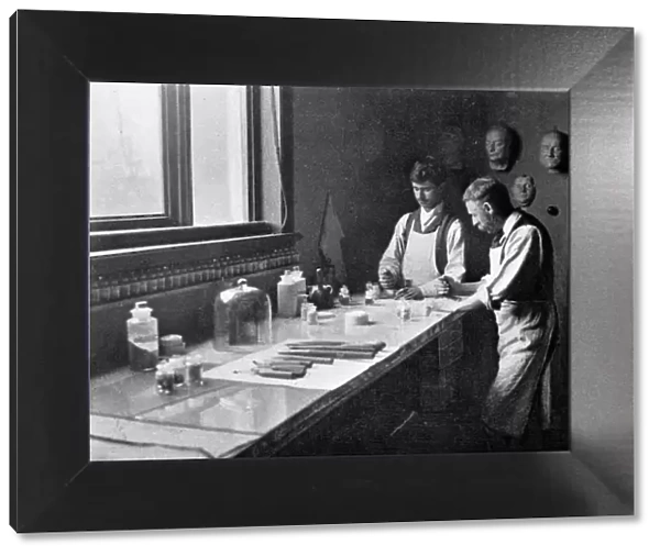 In Professor Herkomers enamelling studio, grinding colours, 1899