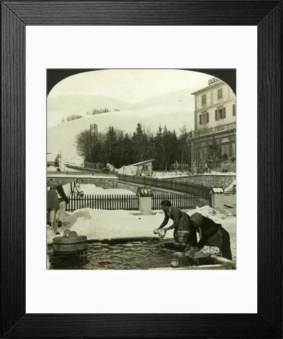 Framed Print : Women washing clothes at the public fountain in midwinter, Zuoz, Switzerland. Artist: HC White Framed Print : Women washing clothes at the public fountain in midwinter, Zuoz, Switzerland. Artist: HC White