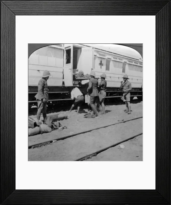 Framed Print : Lifting wounded soldiers onto a hospital train, East Africa, World War I, 1914-1918. Artist: Realistic Travels Publishers Framed Print : Lifting wounded soldiers onto a hospital train, East Africa, World War I, 1914-1918. Artist: Realistic Travels Publishers
