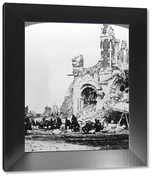German prisoners of war beside the ruins of the basilica of Albert, France, World War I, 1914-1918. Artist: Realistic Travels Publishers