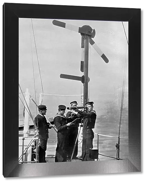 Signalling by semaphore on board HMS Camperdown, 1895. Artist: Gregory & Co