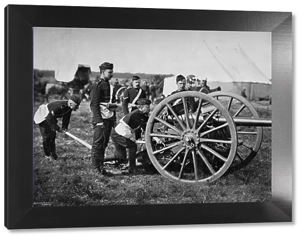 Gunners of field artillery drilling with a 12 pounder, 1895. Artist: Gregory & Co