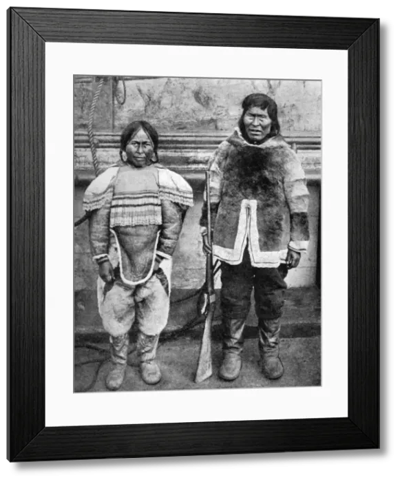 Framed Print : Eskimo hunter and his wife in winter costume, c1922. Artist: Brown Bros Framed Print : Eskimo hunter and his wife in winter costume, c1922. Artist: Brown Bros