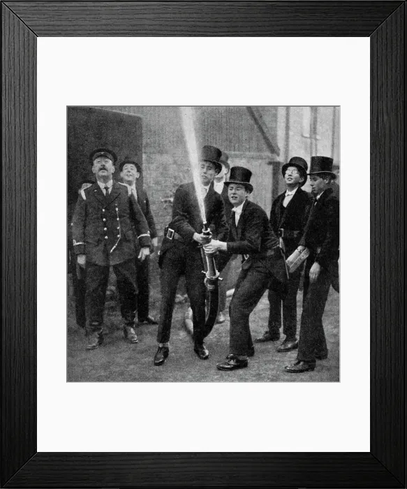 Framed Print : Etons amateur firemen practising a hose drill, Berkshire, c1922 Framed Print : Etons amateur firemen practising a hose drill, Berkshire, c1922