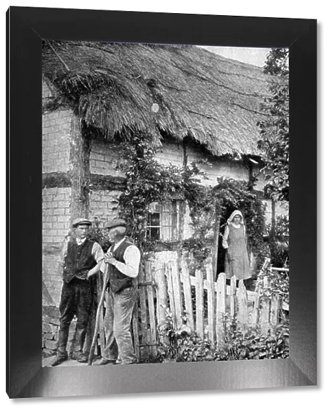Two men chatting outside a cottage, near Lucton, Herefordshire, c1922. Artist: AW Cutler