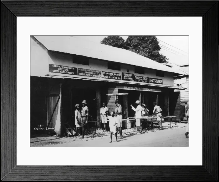 Framed Print : People outside an undertakers premises, Sierra Leone, 20th century Framed Print : People outside an undertakers premises, Sierra Leone, 20th century
