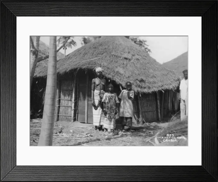 Framed Print : A family in front of their home, Gambia, 20th century Framed Print : A family in front of their home, Gambia, 20th century