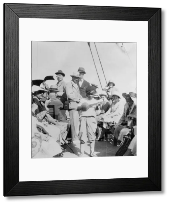 Framed Print : Tourists wathcing a boy playing a ukelele, Havana, Cuba, 1931 Framed Print : Tourists wathcing a boy playing a ukelele, Havana, Cuba, 1931
