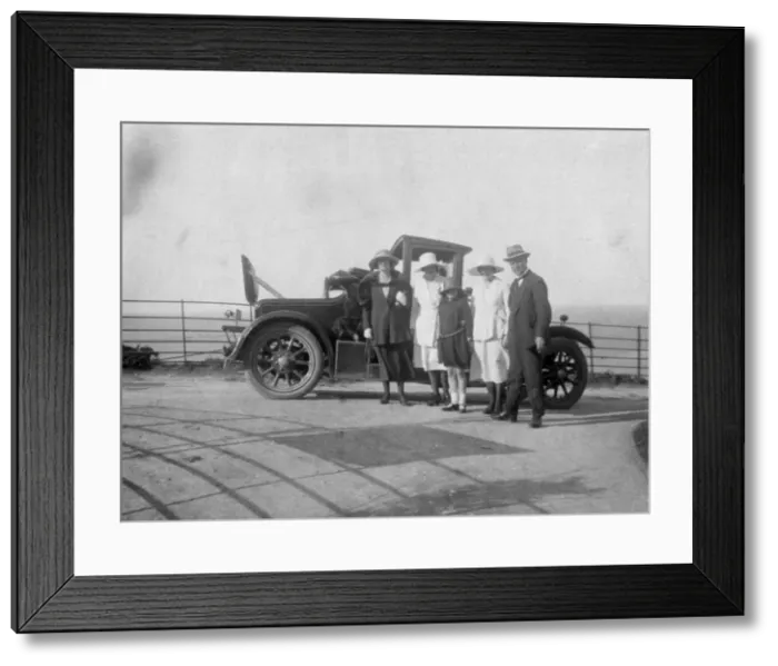 Framed Print : A group of people in front of their car at the seaside, c1920s(?) Framed Print : A group of people in front of their car at the seaside, c1920s(?)