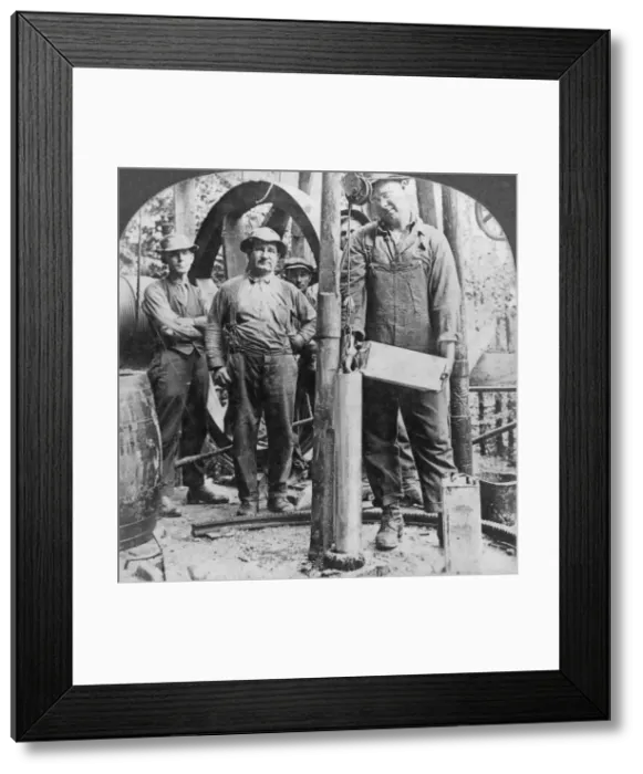 Framed Print : Filling a shell with nitro-glycerine, oil field in Pennsylvania, USA, early 20th century(?). Artist: Keystone View Company Framed Print : Filling a shell with nitro-glycerine, oil field in Pennsylvania, USA, early 20th century(?). Artist: Keystone View Company