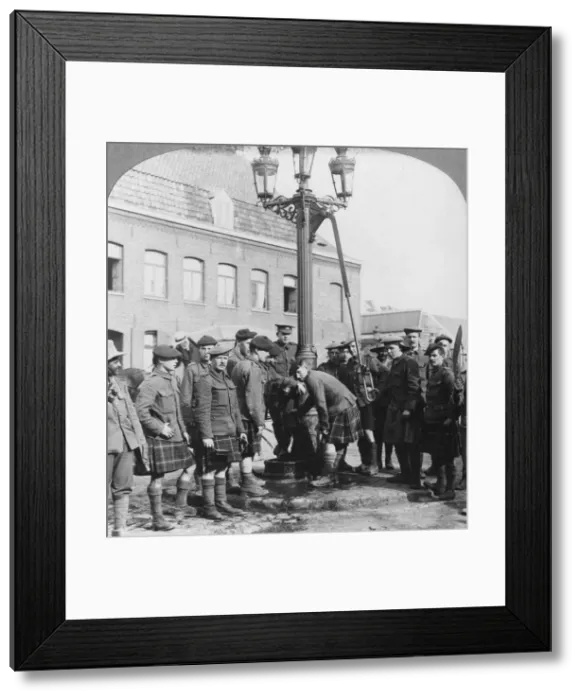 Framed Print : Soldiers filling their water bottles at the town pump La Gorgue, France, World War I, c1914-c1918. Artist: Realistic Travels Publishers Framed Print : Soldiers filling their water bottles at the town pump La Gorgue, France, World War I, c1914-c1918. Artist: Realistic Travels Publishers