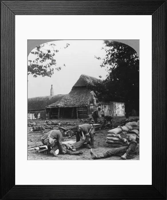 Framed Print : Stretcher bearers caring for wounded at an improvised first aid post, World War I, c1914-c1918. Artist: Realistic Travels Publishers Framed Print : Stretcher bearers caring for wounded at an improvised first aid post, World War I, c1914-c1918. Artist: Realistic Travels Publishers