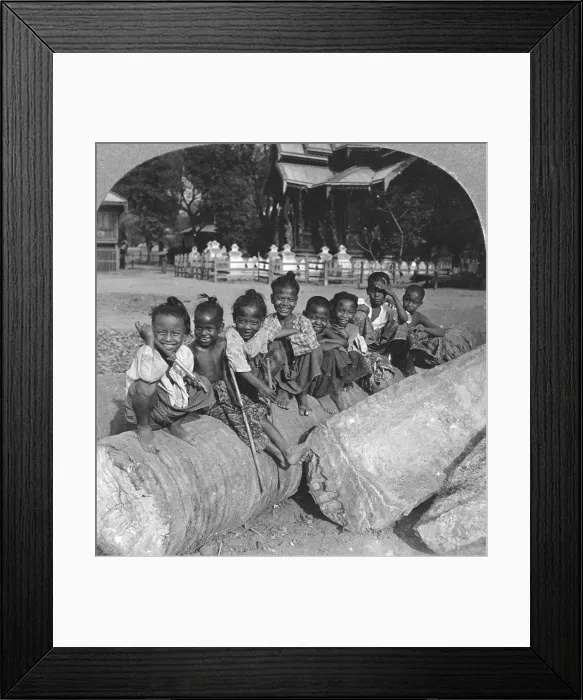 Framed Print : Burmese children sitting on a palm log, Burma, 1908. Artist: Stereo Travel Co Framed Print : Burmese children sitting on a palm log, Burma, 1908. Artist: Stereo Travel Co