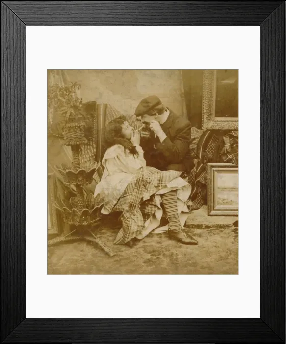 Framed Print : Couple lighting a cigarette from each other, 1900 Framed Print : Couple lighting a cigarette from each other, 1900