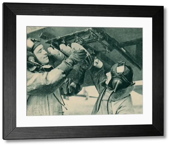 Framed Print : Air observer receiving bombing training, 1940 Framed Print : Air observer receiving bombing training, 1940