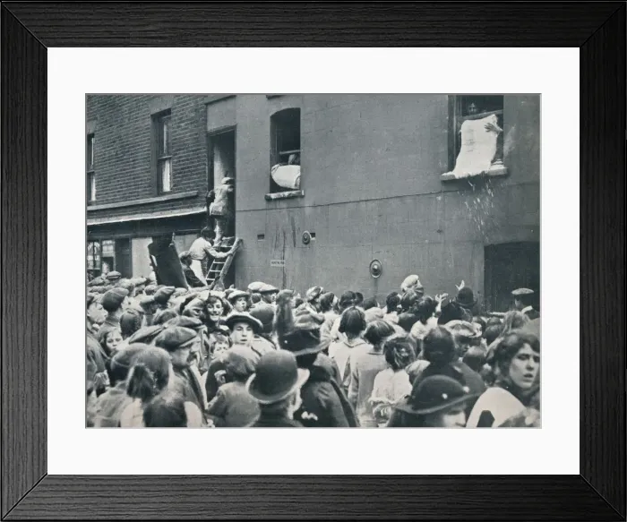 Framed Print : Crowd watching the looting of a German house in Poplar, c1914 Framed Print : Crowd watching the looting of a German house in Poplar, c1914
