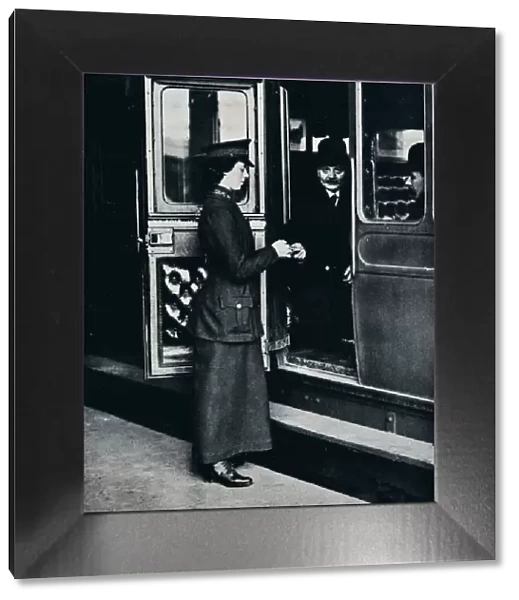 A woman ticket inspector at work, c1914