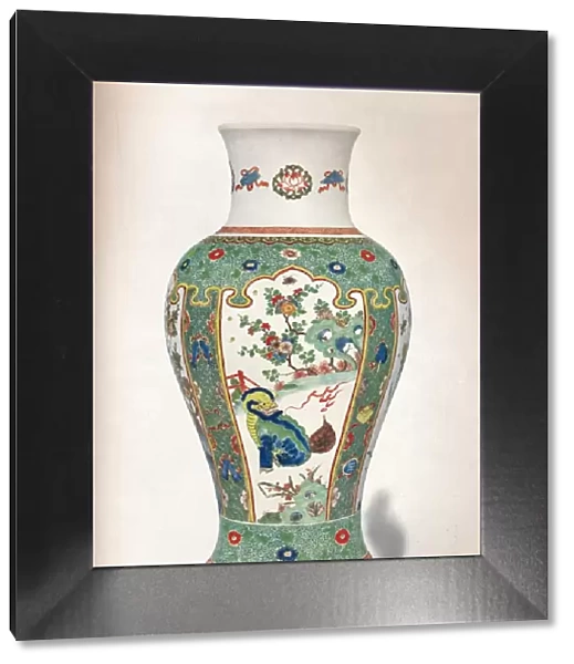 Famille Verte Vase, with four upright panels painted with rocks and flowering plants, two monsters