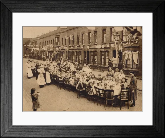 Framed Print : A childrens tea party in an East End Street in London, to celebrate the Treaty of Versailles at t Framed Print : A childrens tea party in an East End Street in London, to celebrate the Treaty of Versailles at t