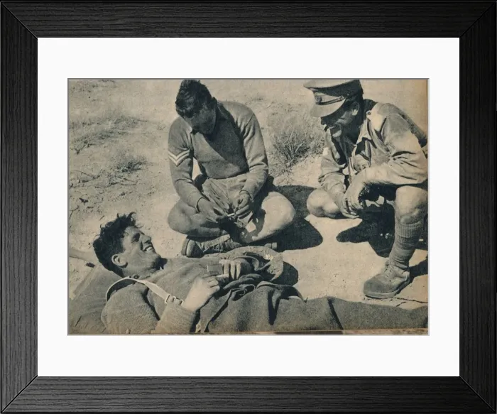 Framed Print : Ambulance men with a wounded anti-tank gunner, c1942 (1944) Framed Print : Ambulance men with a wounded anti-tank gunner, c1942 (1944)