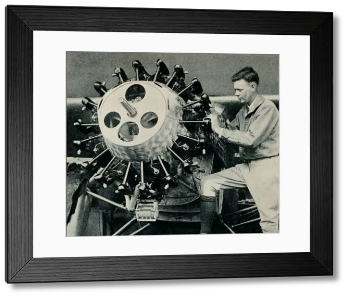 Framed Print : Charles Lindbergh checking the engine of his aircraft before his transatlantic flight, 1927 (c1937) Framed Print : Charles Lindbergh checking the engine of his aircraft before his transatlantic flight, 1927 (c1937)