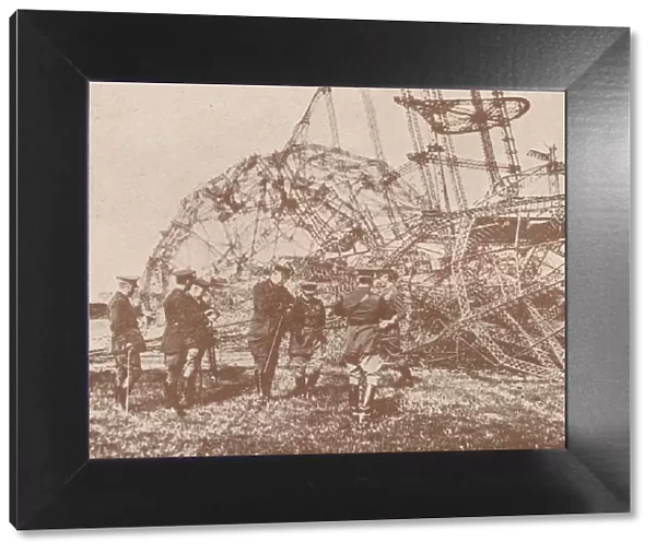 British staff officers examining the wreckage of a Zeppelin brought down in England, c1917 (1919)
