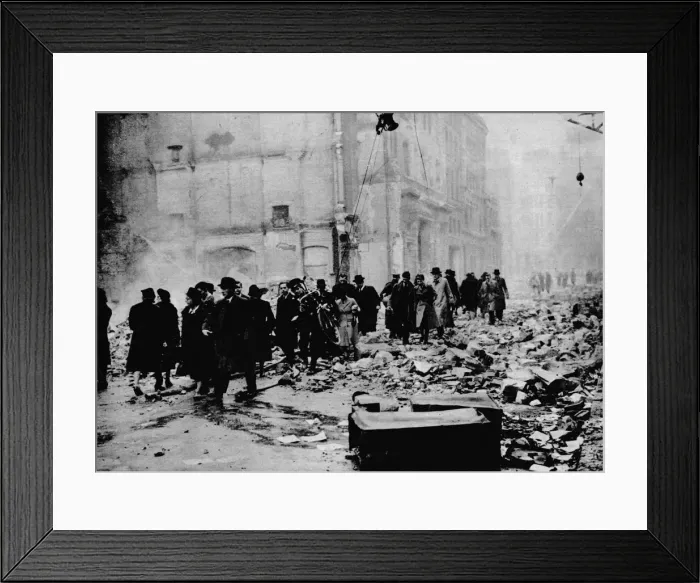 Framed Print : In the morning, work as usual. After a big raid, the way to the office is knee-deep in rubble. Lond Framed Print : In the morning, work as usual. After a big raid, the way to the office is knee-deep in rubble. Lond