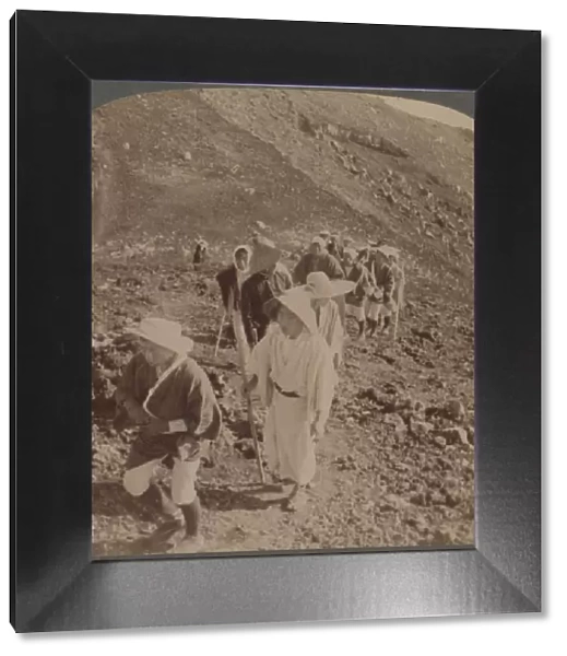 Pilgrims, at end of weary ascent, in worship encircling crater of sacred Fujiyama, Japan, 1904