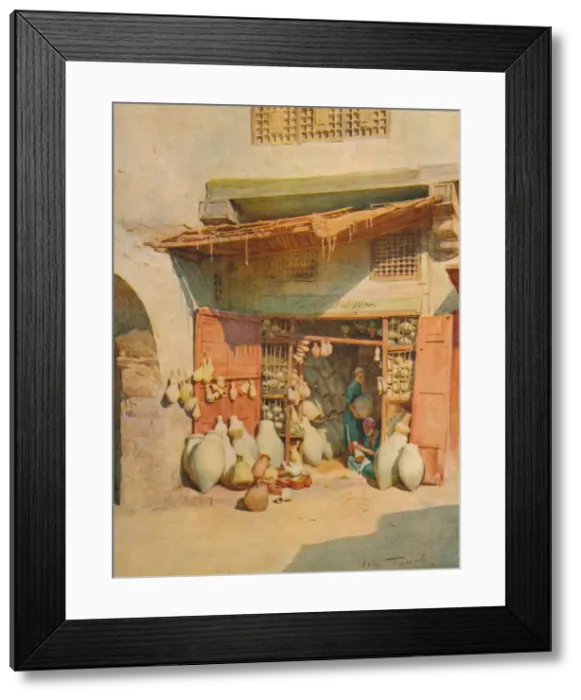 Framed Print : Pottery Bazaar in a Nile Village, c1905, (1912). Artist: Walter Frederick Roofe Tyndale Framed Print : Pottery Bazaar in a Nile Village, c1905, (1912). Artist: Walter Frederick Roofe Tyndale