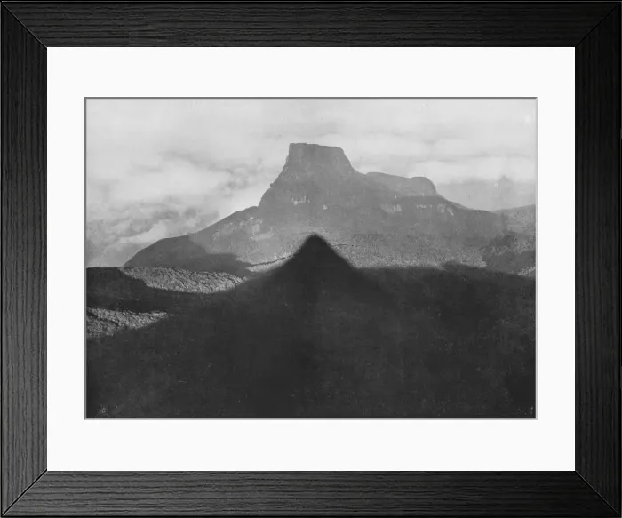 Framed Print : The Shadow of Adams Peak and Bible Rock. Taken from the Peak at Sunrise, c1890, (1910). Artist: Alfred William Amandus Plate Framed Print : The Shadow of Adams Peak and Bible Rock. Taken from the Peak at Sunrise, c1890, (1910). Artist: Alfred William Amandus Plate