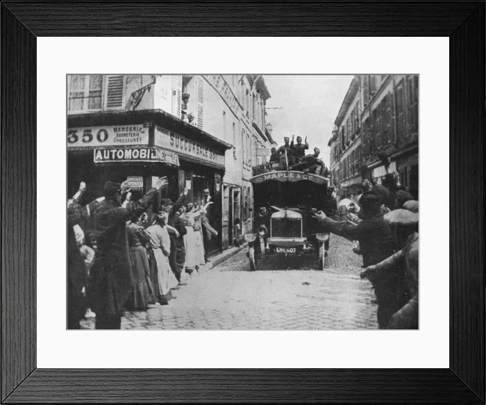 Framed Print : British troops receive a welcome as they arrive by motor van in a French town, 1915 Framed Print : British troops receive a welcome as they arrive by motor van in a French town, 1915