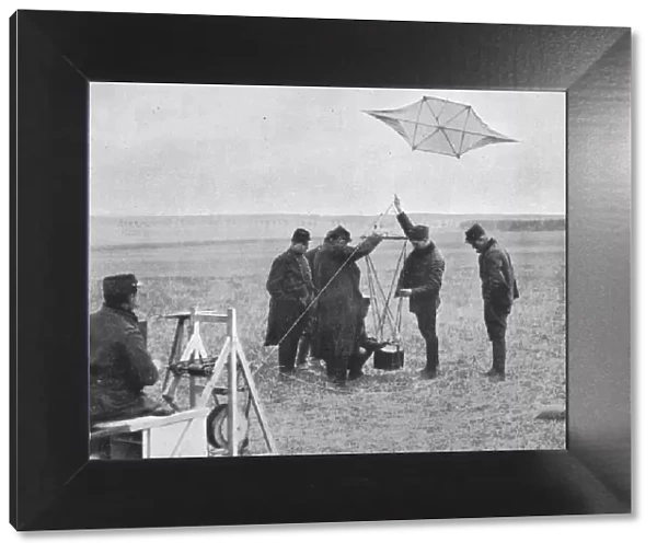 Sending up one of the French war kites, to which a camera is attached, 1914, (1915)