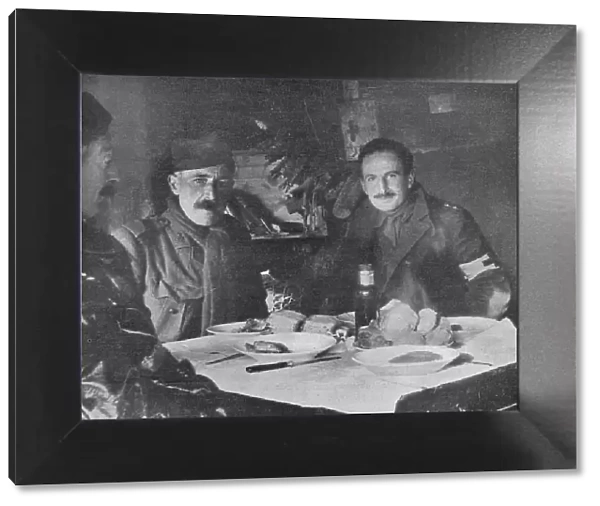 Red Cross officers at dinner in a dug-out, 1914