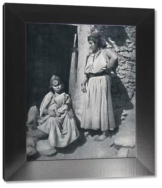Kabyle women at the door of their dwelling near the Mediterranean coast, Algeria, 1912 Artist: Kuhn