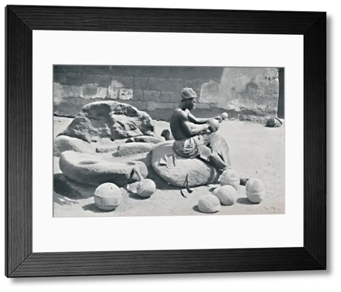 Framed Print : A Yoruba man engraving clay bowls and water jars, Lagos hinterland, Southern Nigeria, 1912. Artist: AW Gelston Framed Print : A Yoruba man engraving clay bowls and water jars, Lagos hinterland, Southern Nigeria, 1912. Artist: AW Gelston